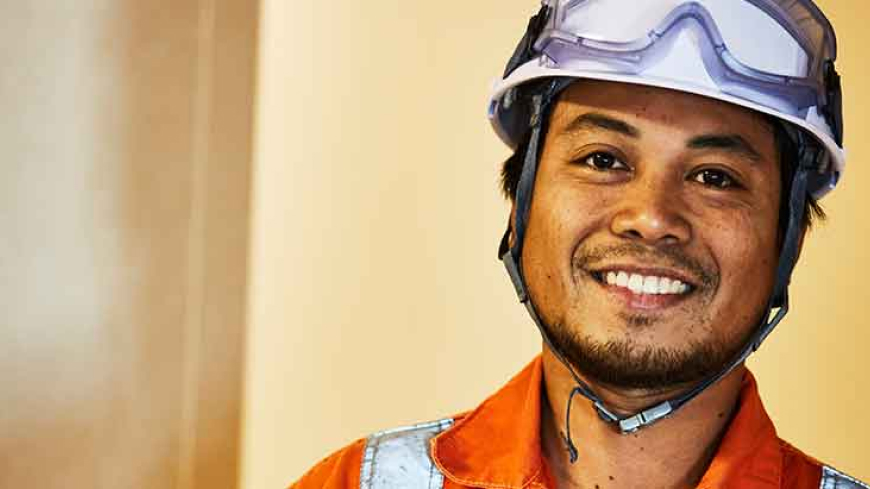 Worker with helmet and hi-vis on