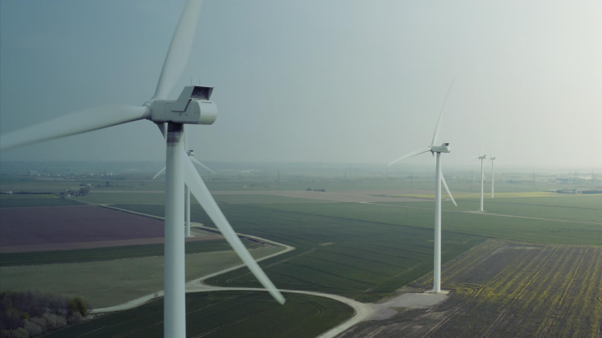 two wind turbines in the countryside