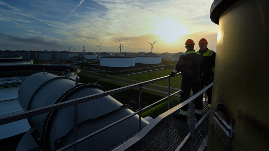 Two workers at a VPR refinery