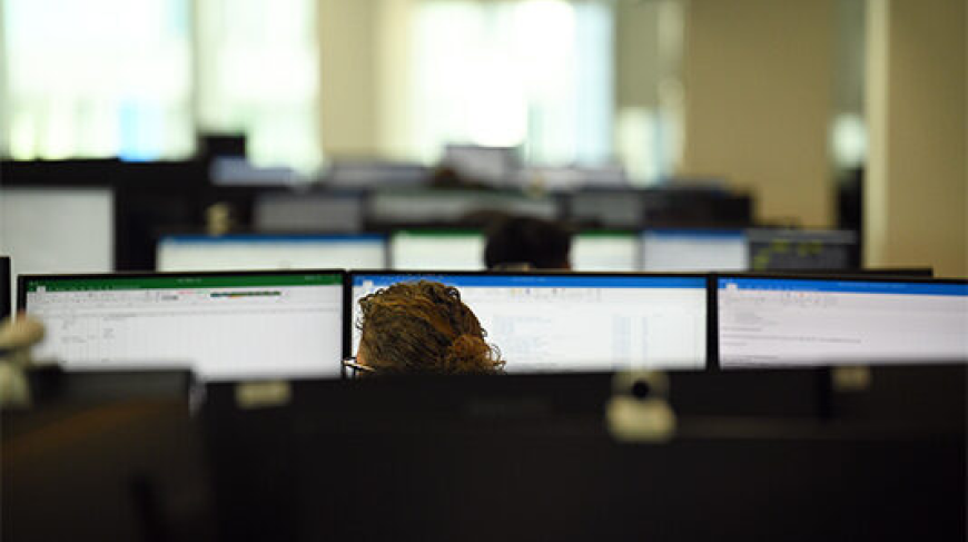 Image of office and tops of desktop screens